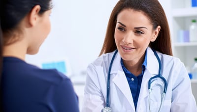 A caring doctor consulting with a female patient in a modern clinic setting
